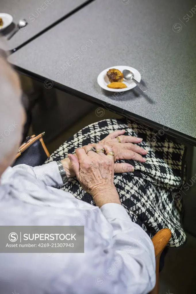 Elderly person eating.