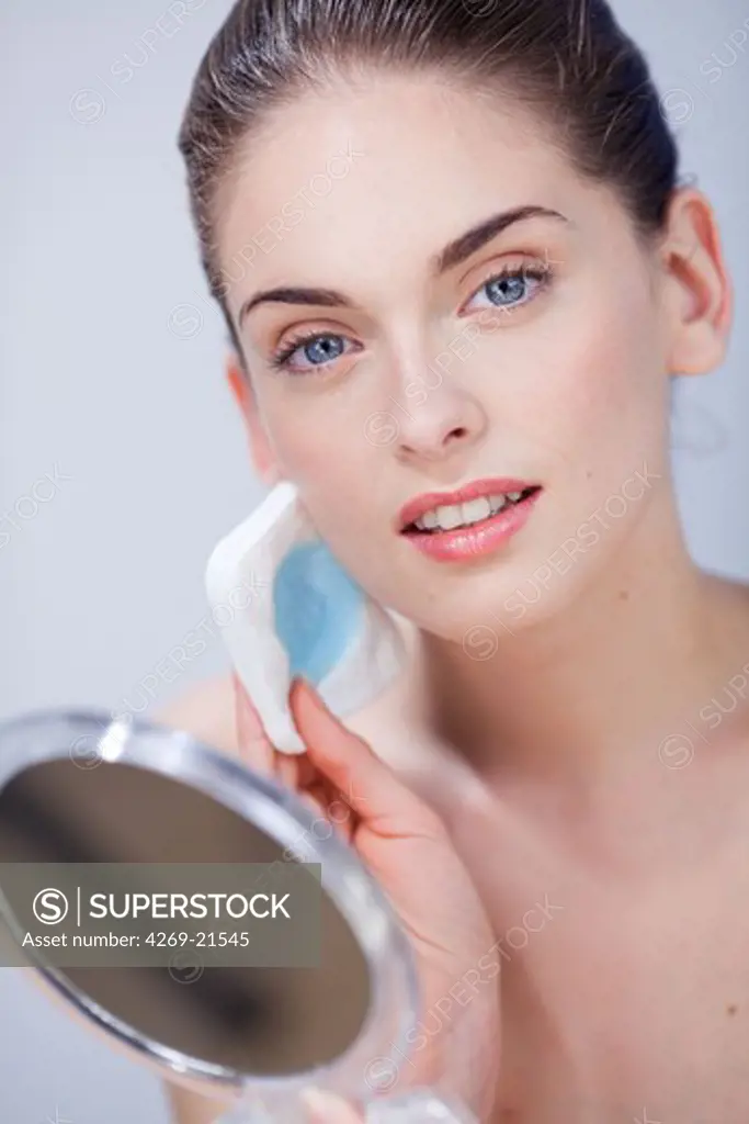 Woman removing make-up.