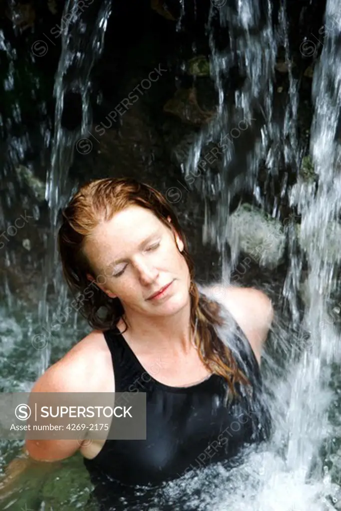 Woman bathing in geothermal hot springs.