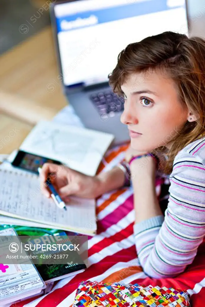 Teenage girl revising exams.