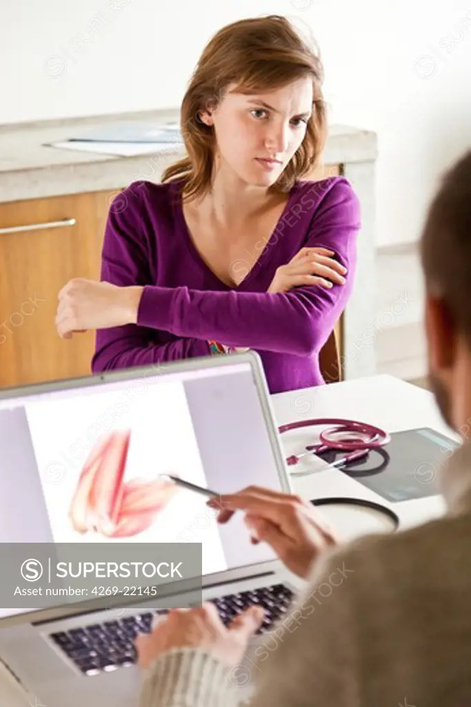 Woman consulting for arm pain.