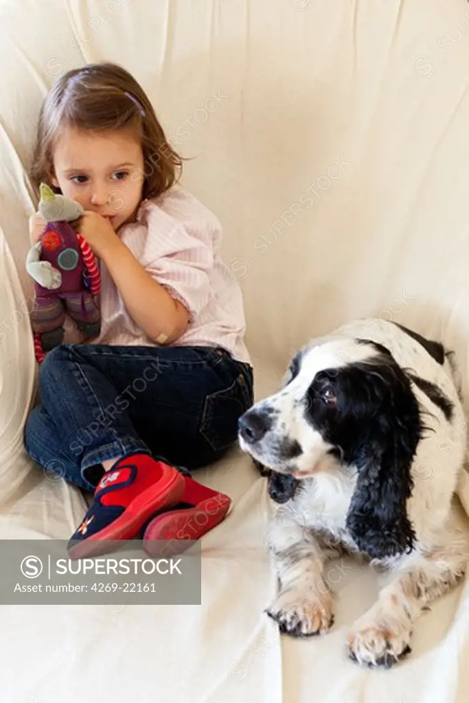 3 years old girl with her dog.