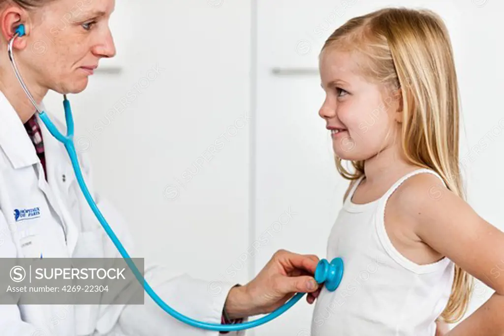 Doctor examining a 5 year old girl with a stethoscope.