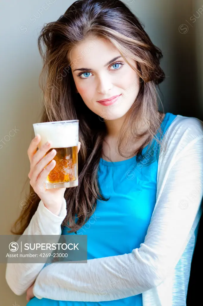 Woman drinking beer.