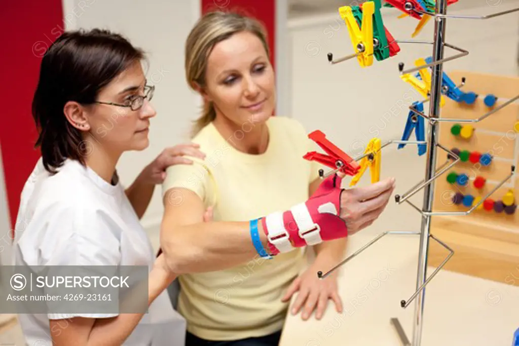 Functional rehabilitation of a hemiplegic woman. Occupational therapy session. Department of Physical Medicine and Rehabilitation, Limoges hospital, France.