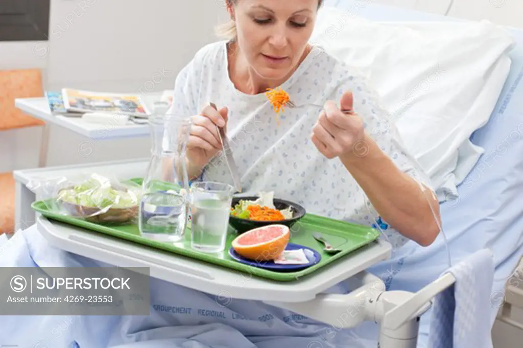 Hospitalized woman having lunch.