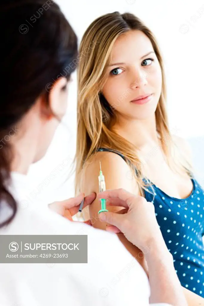 Teenage girl receiving Gardasil vaccination. Gardasil is a vaccine against certain types of the human papillomavirus (HPV) responsible for cervical cancer.