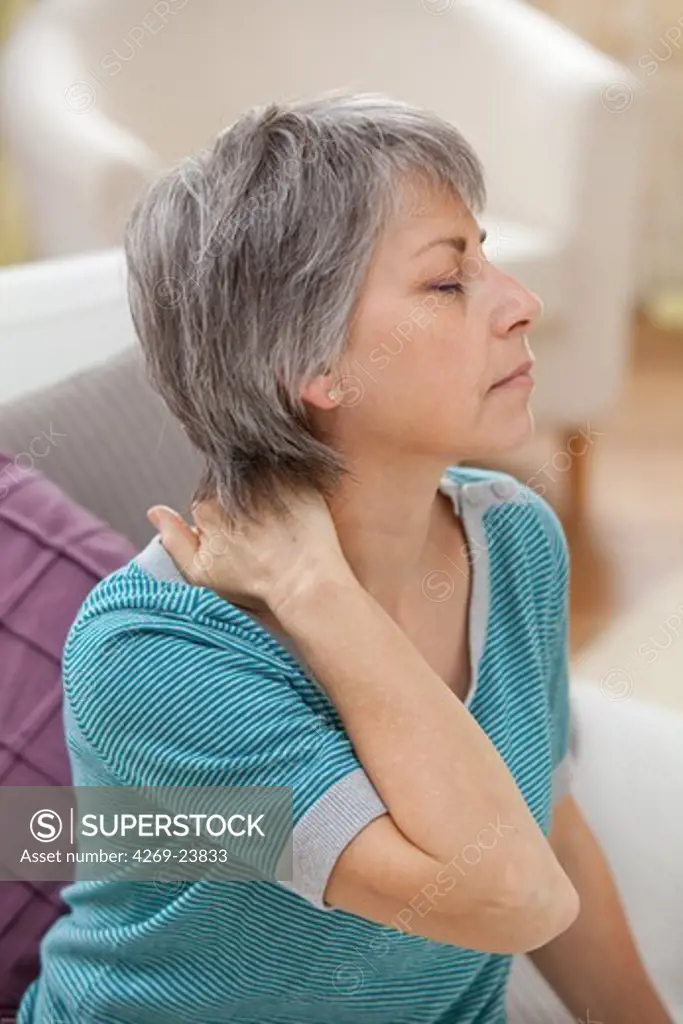 Woman suffering from neck pain.