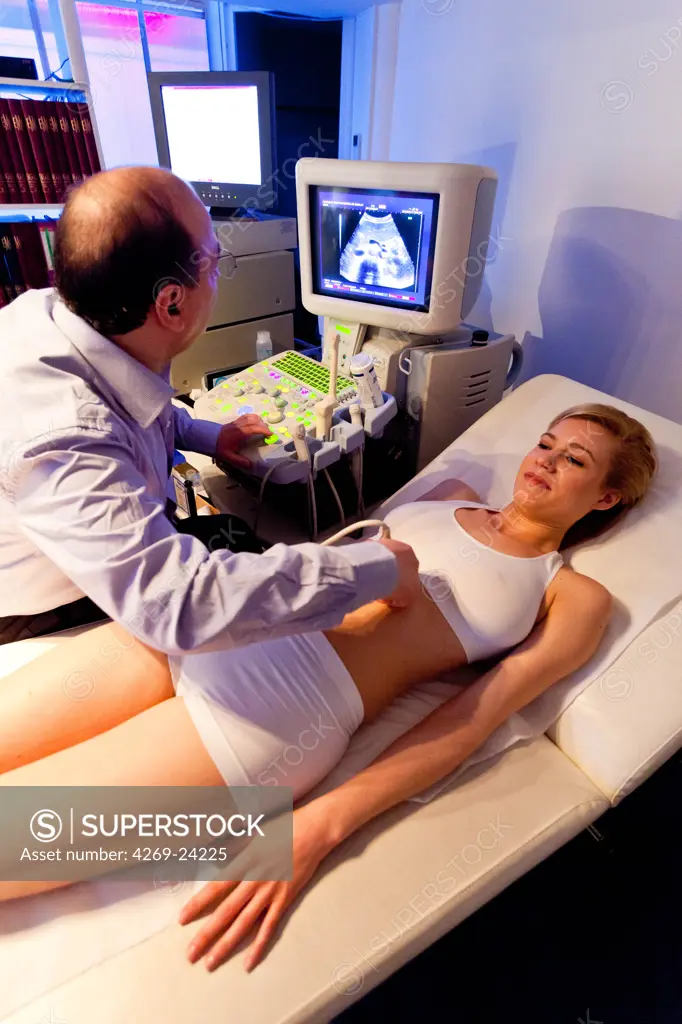Woman undergoing abdominal ultrasound scan.