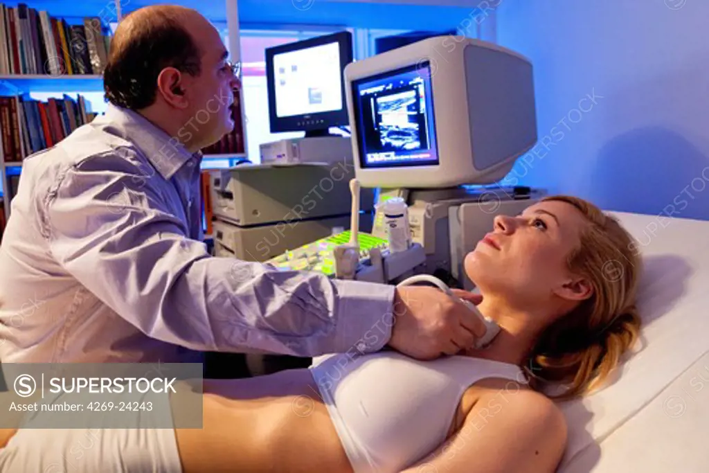 Woman undergoing a carotid artery doppler ultrasound scan.