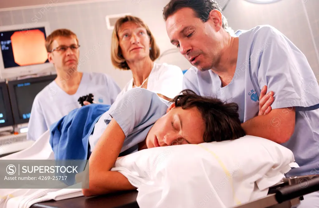 Hypnosis. A patient undergoes a coloscopy under hypnosis, performed by the Dr Philippe Rault, anesthetist at the Univertsity Hospital of Rennes, France. Screening of colon cancer.