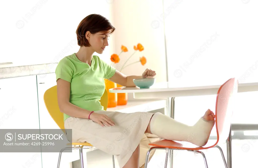 Woman. Woman with her leg in plaster
