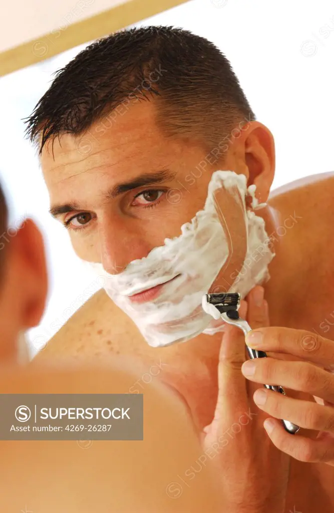 Man. Man shaving.