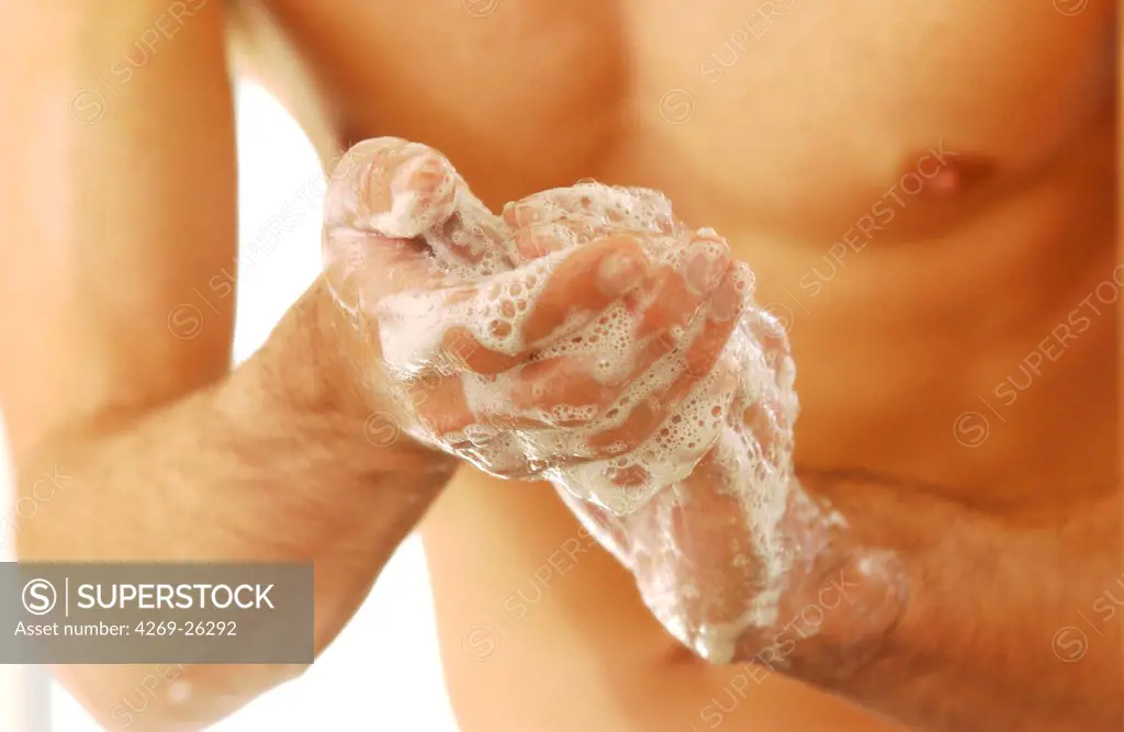 Hygiene. Man washing his hands.