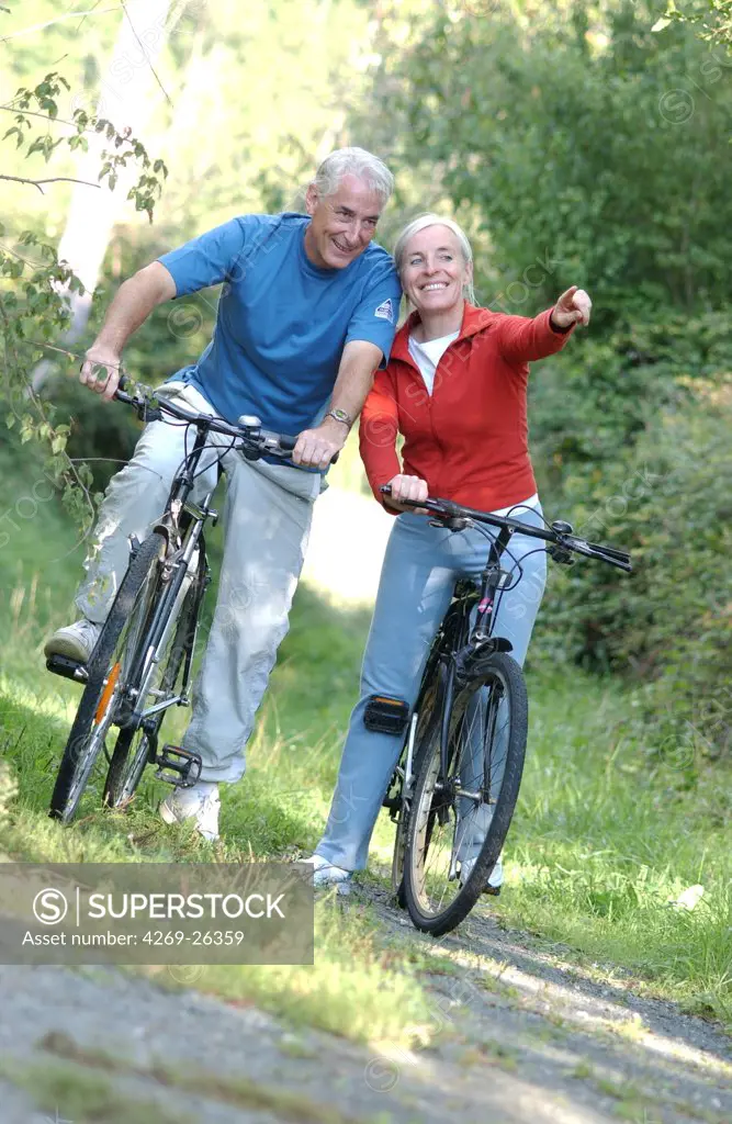 Sport. Senior couple on a bicycle ride.
