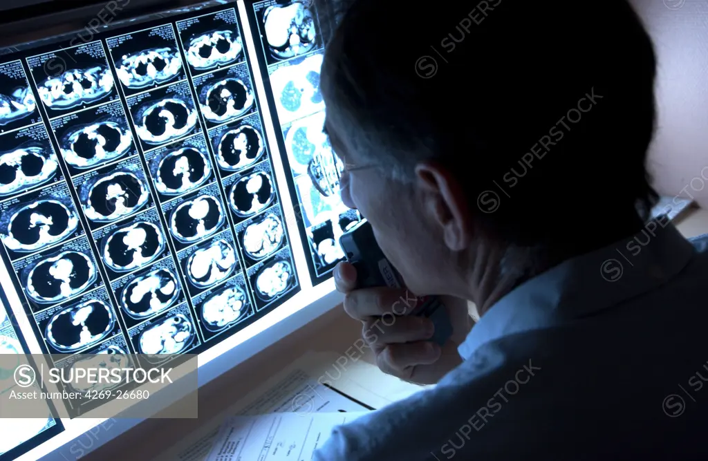 Radiologist. After examination of the X-rays and Ct scans, the radiologist record his diagnostic and report on a voice recorder.