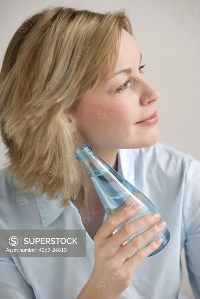 Woman. Woman drinking mineral water.