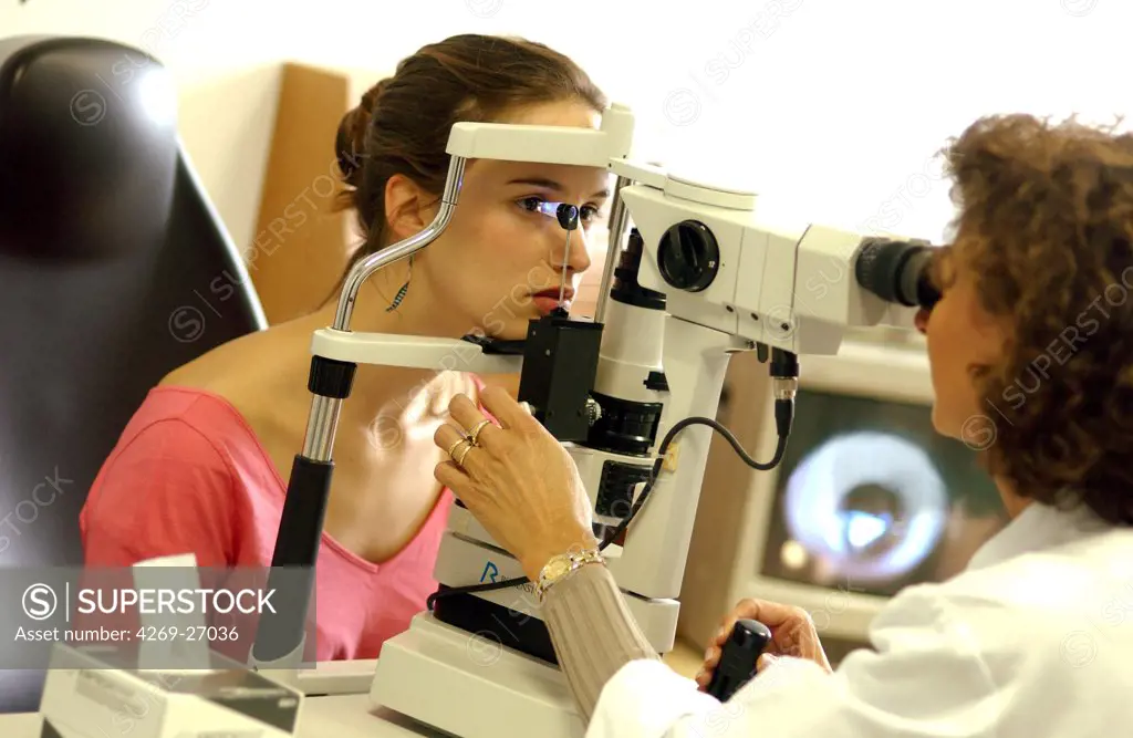 Ophthalmology. Ophtalmologist checking the intraocular pressure of the patient using a tonometer, in order to detect glaucoma.