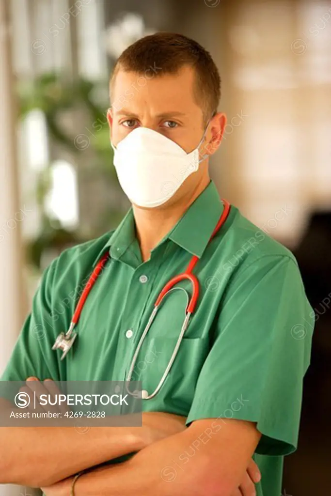 Doctor wearing a protective breathing mask FFP2 (in conformity with the standard EN149:2001). It is recommended to wear this mask in case of flu pandemic.