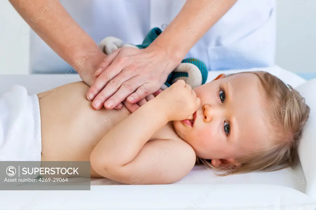 Doctor performing respiratory physiotherapy on a 17 months old infant.