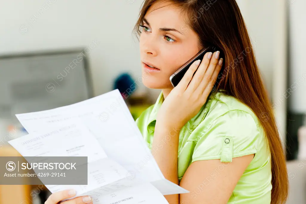 Woman reading medical analysis results.