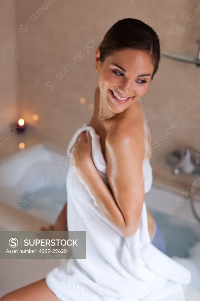 Woman in her bathroom.