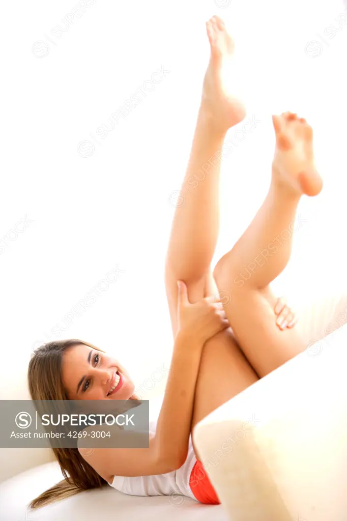 Woman with legs up.