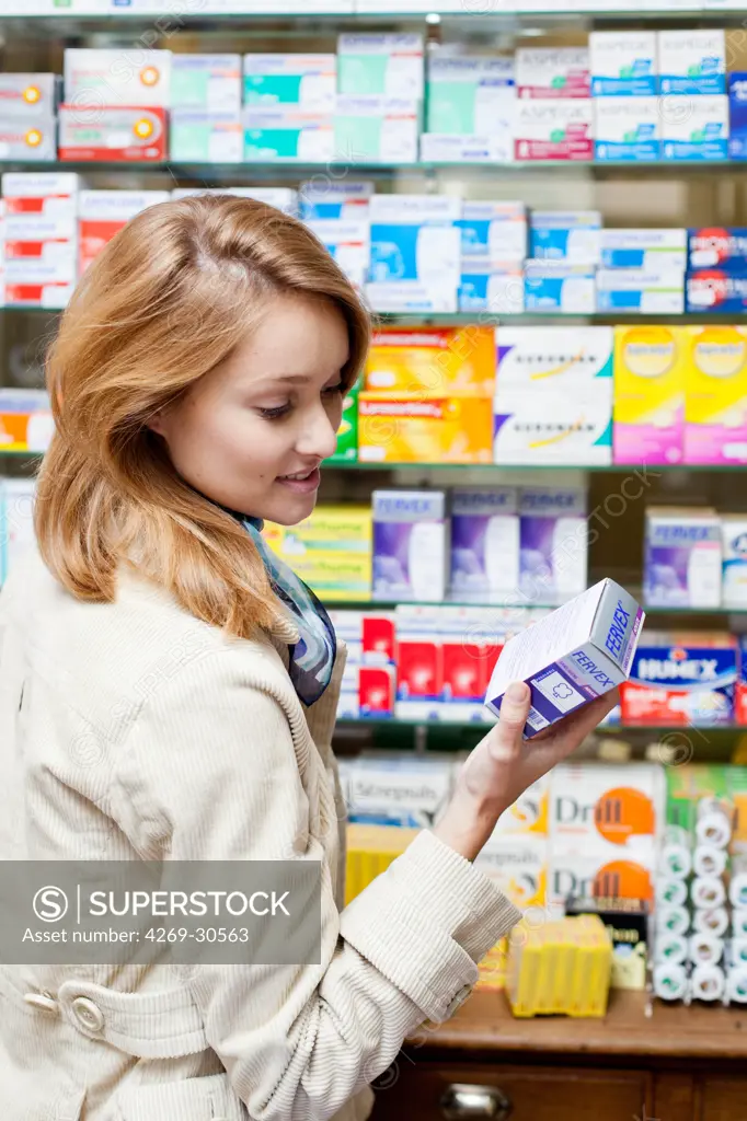 Pharmacy. Woman buying medications in a pharmacy.