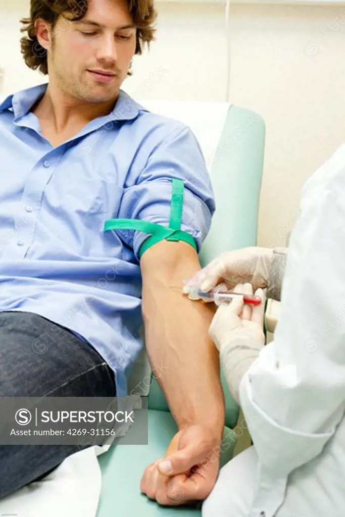 Blood sample. Man having a blood sample.