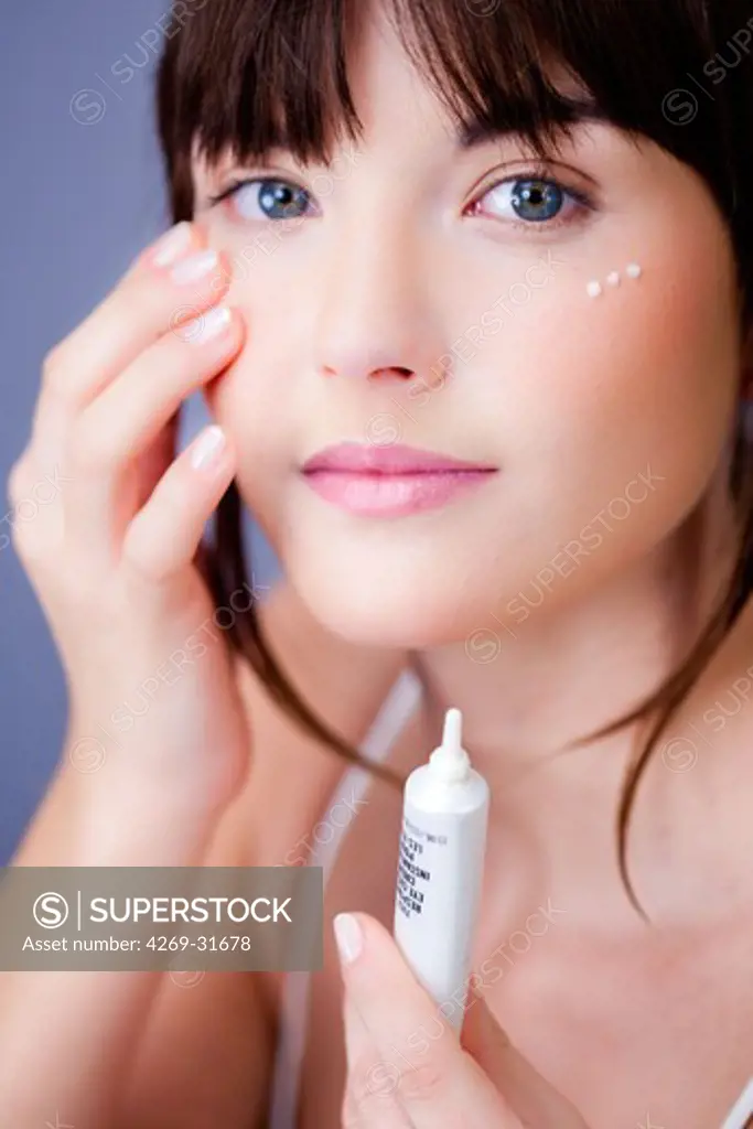 woman applying anti-wrinkle cream around the eyes.