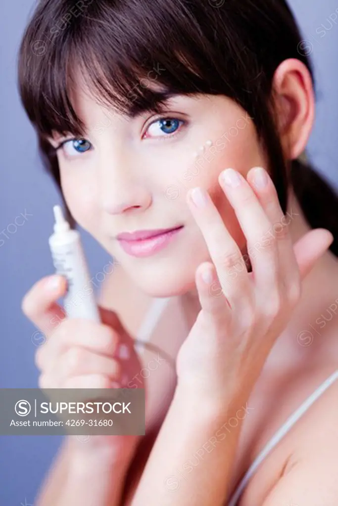 woman applying anti-wrinkle cream around the eyes.