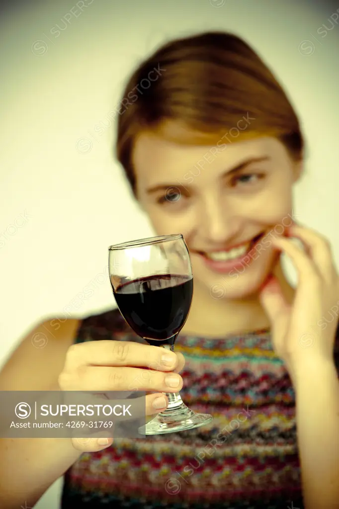 woman drinking a glass of red wine.