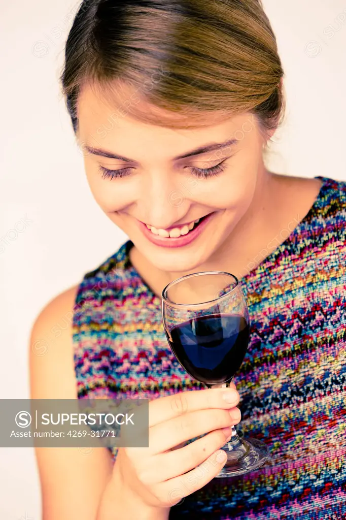 woman drinking a glass of red wine.