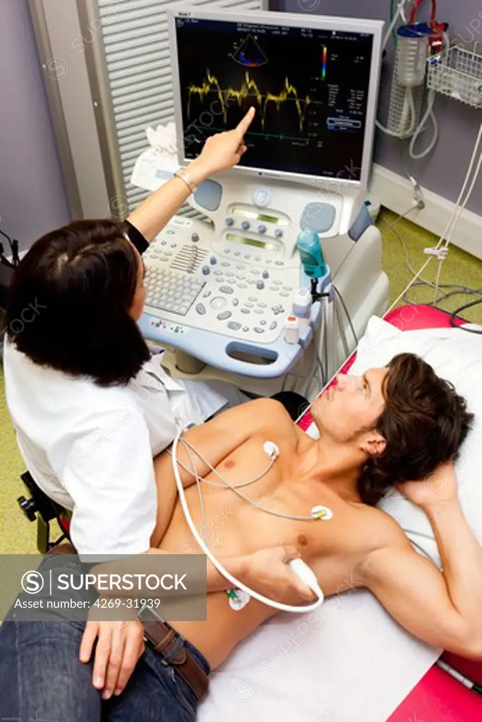 Man undergoing a heart scan doppler. Limoges hospital, France.