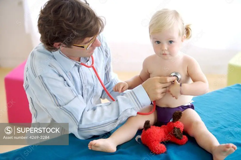 Pediatrician examining a 20 months old baby.