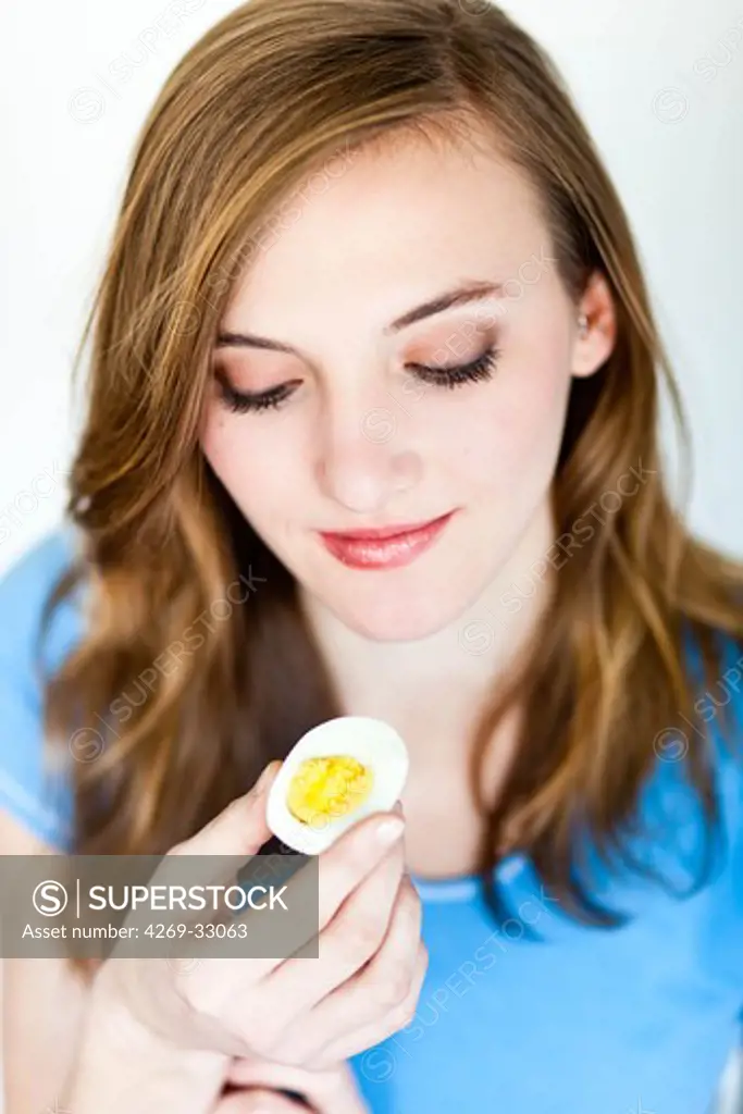 woman holding an egg.