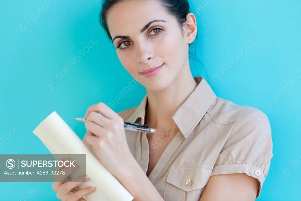 woman writing in her diary.