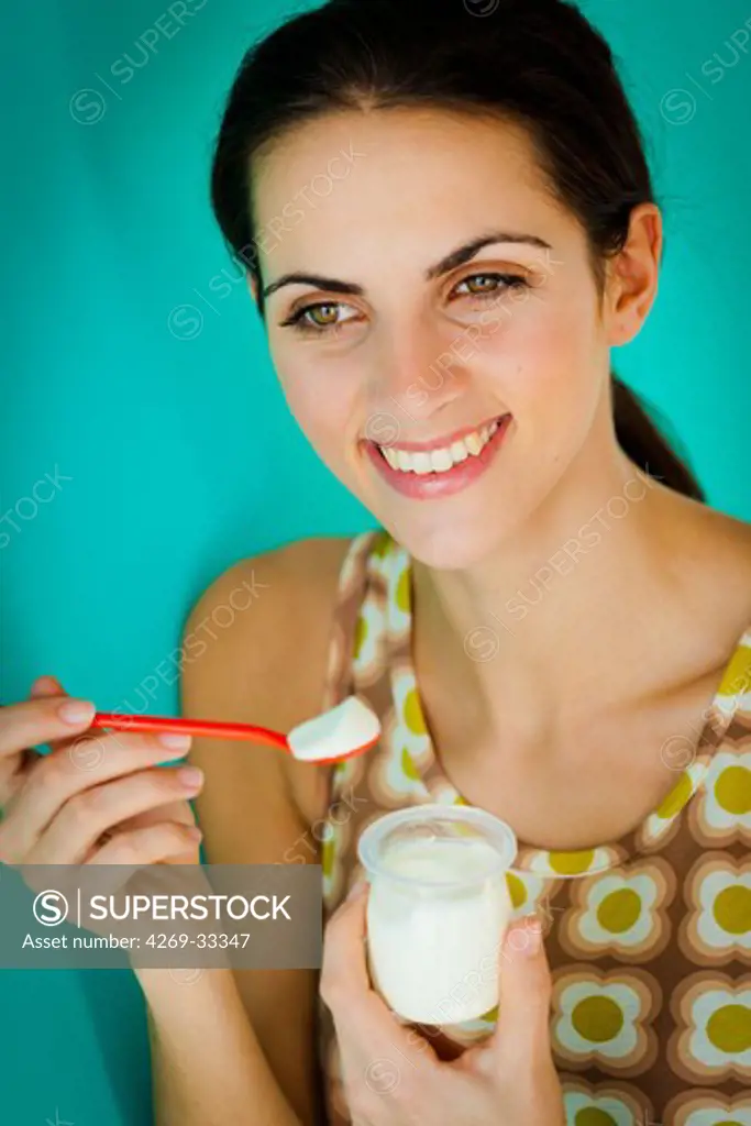 woman eating yogurt.