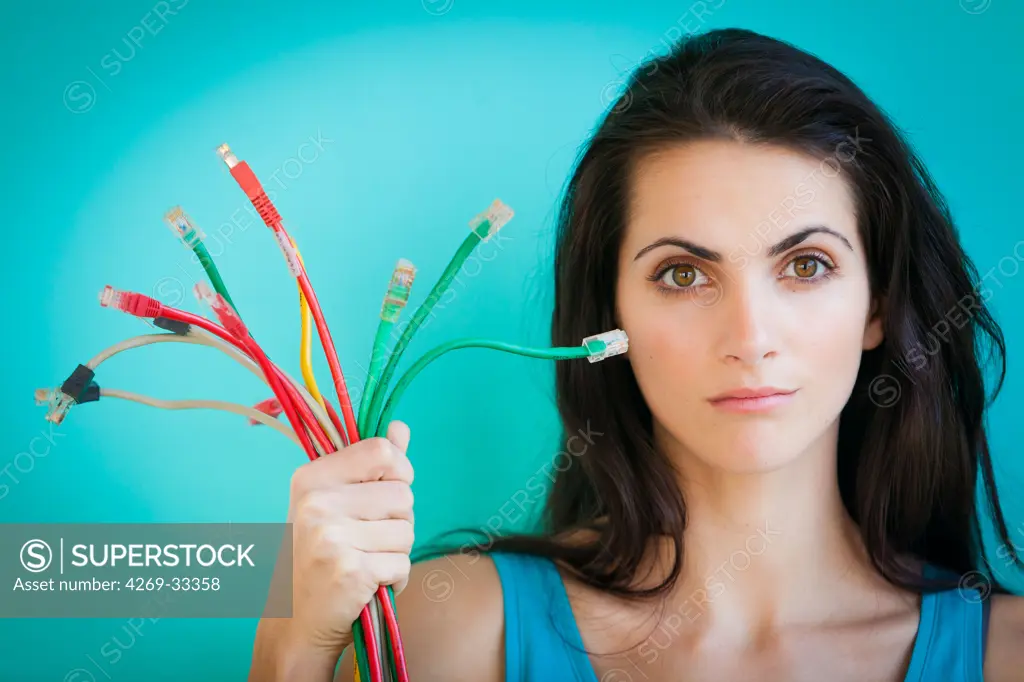 woman holding ethernet cables.