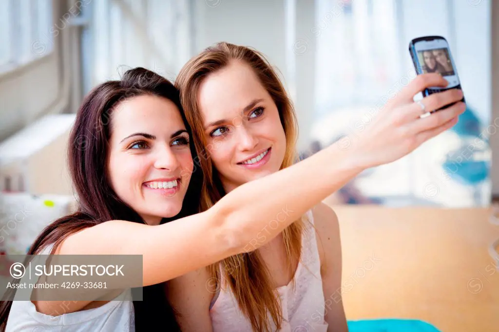 Young women photographing with a Smartphone.