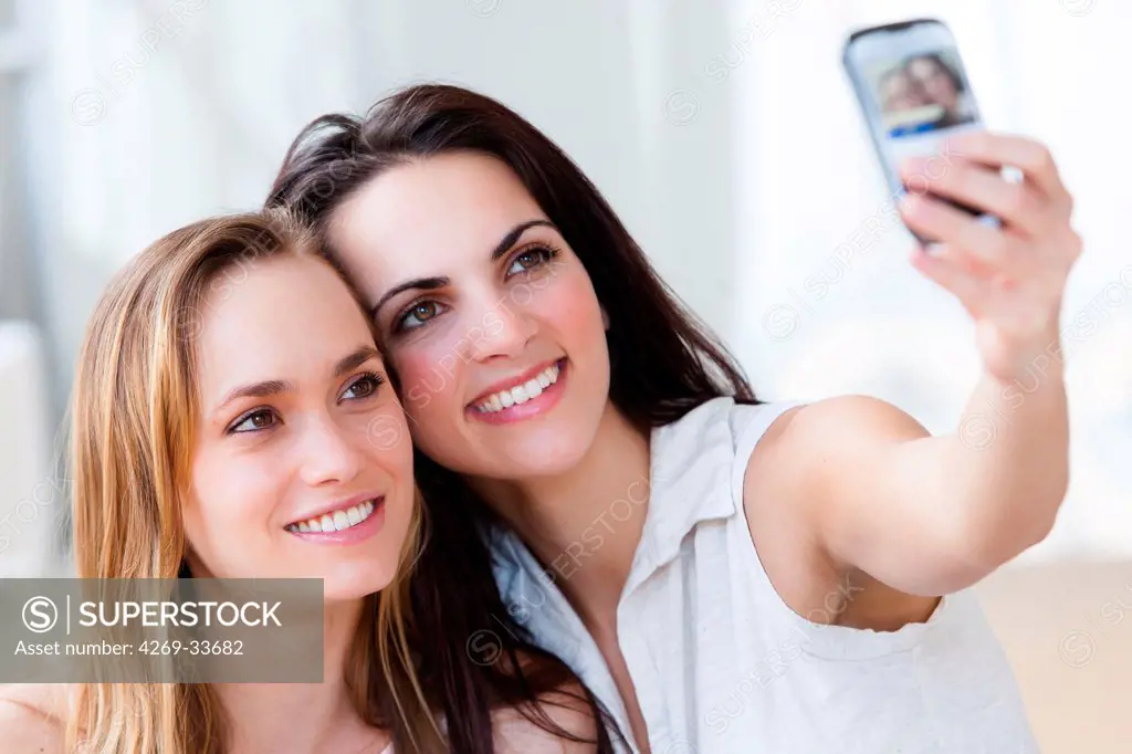 Young women photographing with a Smartphone.