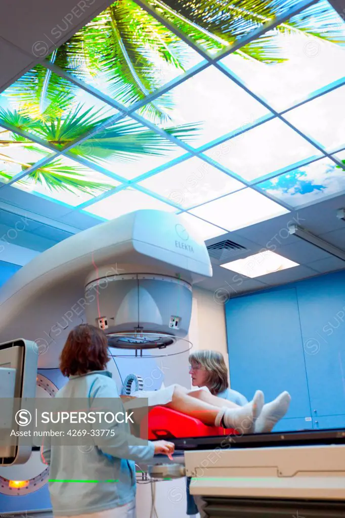 Radiotherapy radiographers with a male patient treated for a prostate cancer with radiotherapy. Latest generation particle accelerator. Radiotherapy center pole of Oncology Hospital of Bordeaux. Hospital Haut-Leveque.