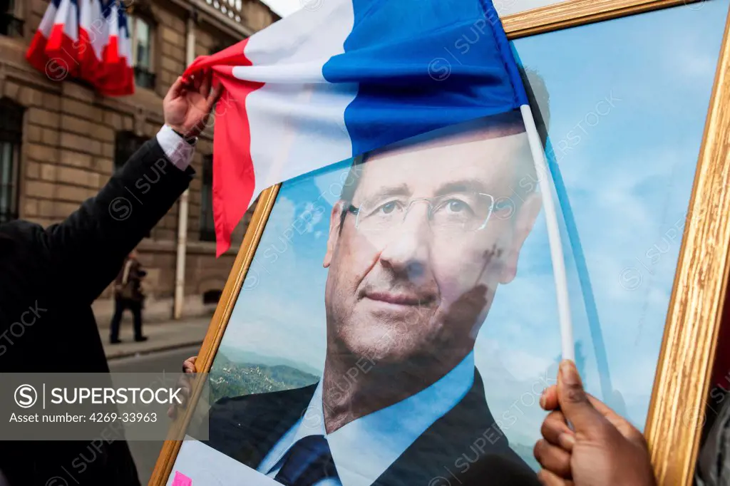 Poster of François Hollande, president of France and french flag.