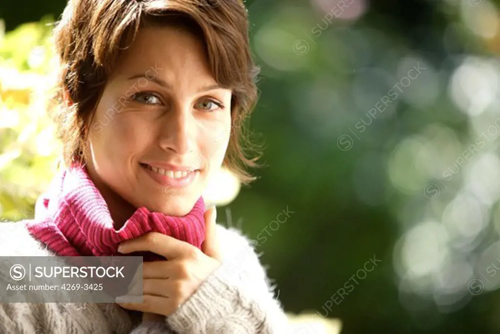 Woman in cold weather smiling.