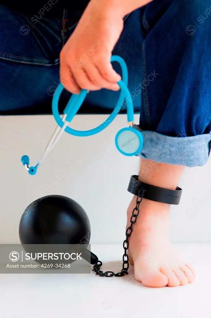 Ball and chain attached to the ankle of a general practitionner.