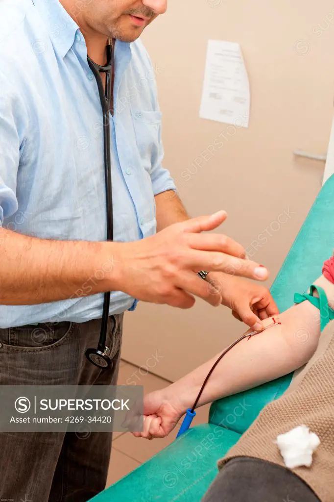 General practitioner practicing bleeding.