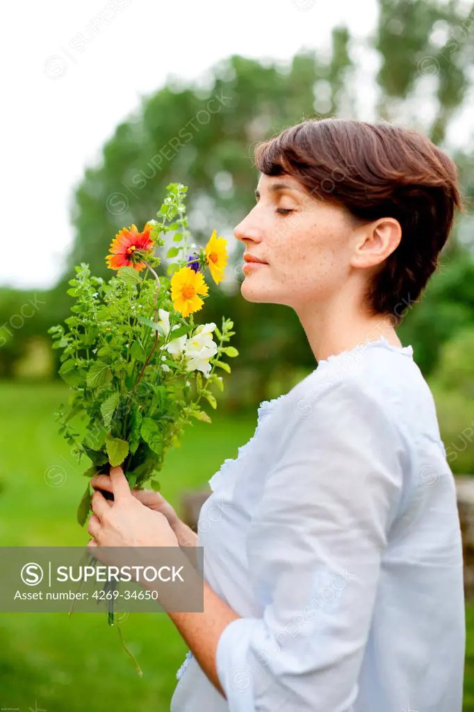 Woman holding flowers.