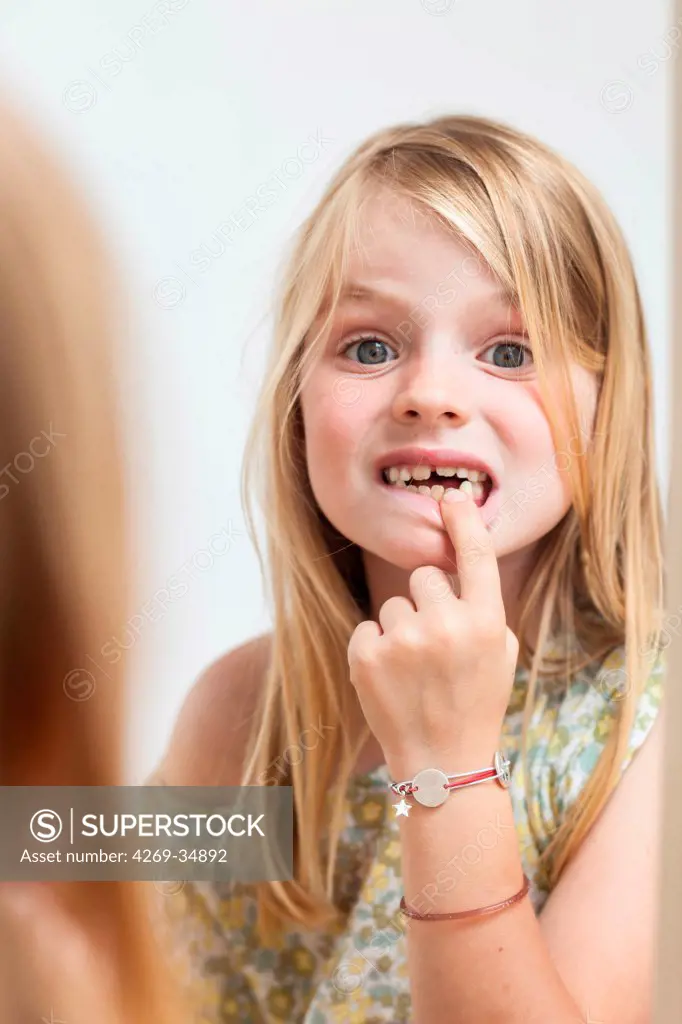 7 years old girl with milk teeth