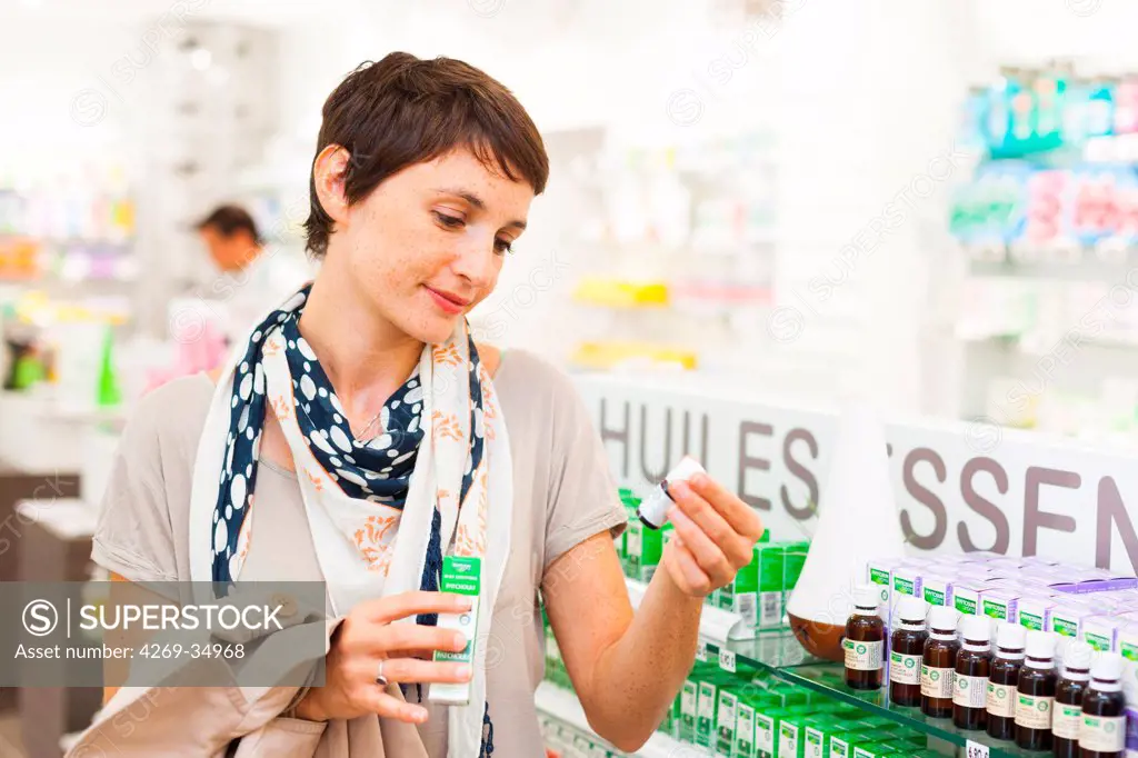 Woman shopping for aromatherapy products in pharmacy
