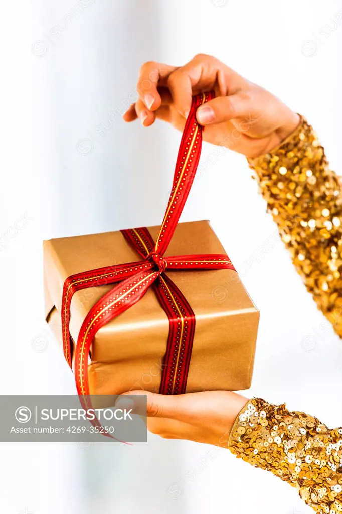 Woman opening a present